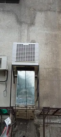 Cooler with a vertical duct drop